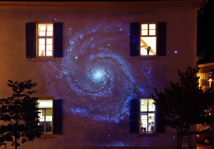 large projection onto a house facade
